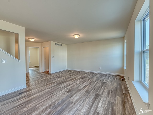 empty room featuring wood-type flooring