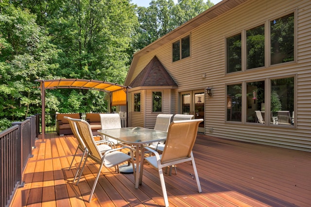 wooden deck with outdoor dining area