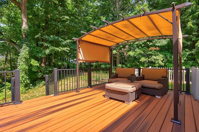 wooden deck with a pergola and an outdoor hangout area