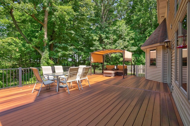 wooden deck with outdoor dining area