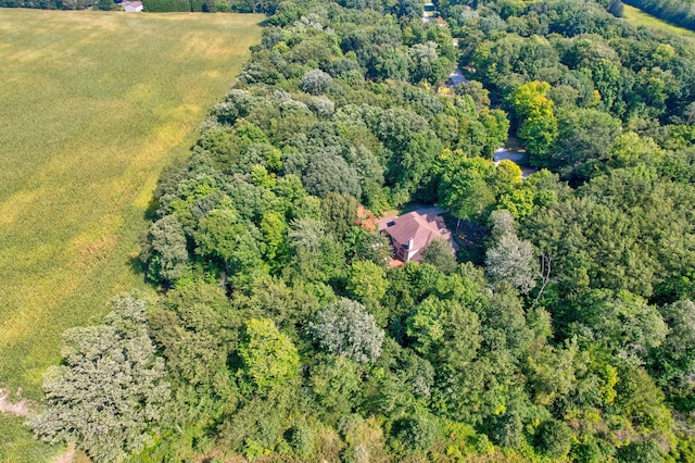 aerial view featuring a wooded view