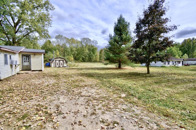 1401 S Miner Rd, Crystal, MI 48818 - view of green lawn with cooling unit