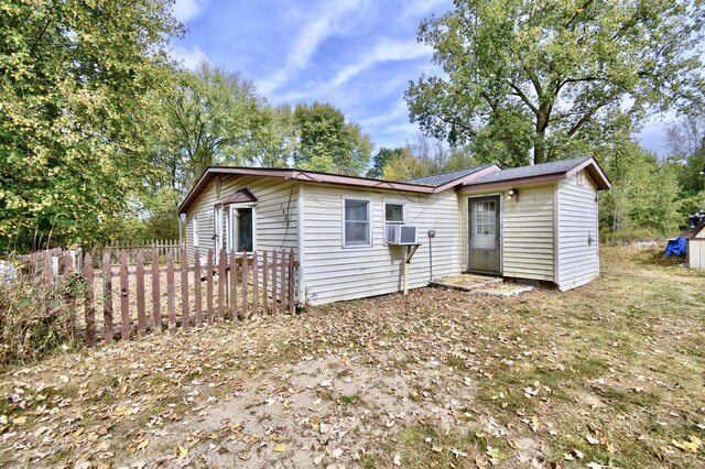 1401 S Miner Rd, Crystal, MI 48818 - rear view of house with cooling unit