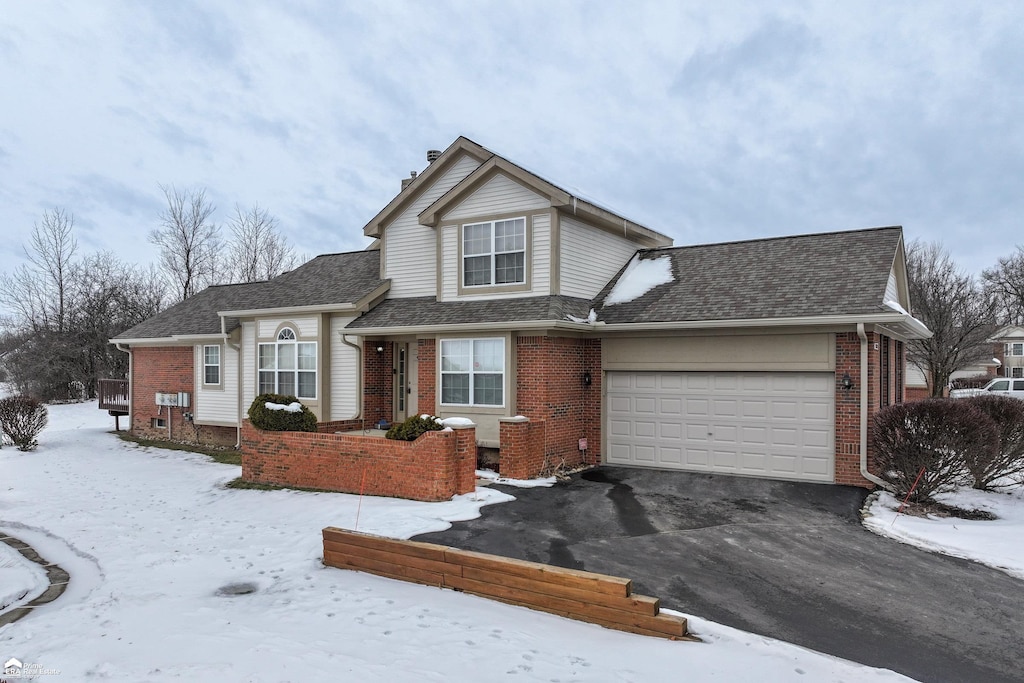 view of front of property with a garage