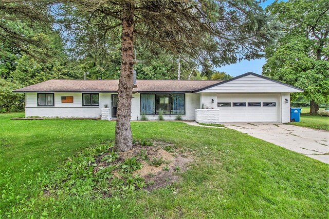 1722 N Benson Rd, Fountain, MI 49410 - single story home featuring an attached garage, driveway, and a front yard