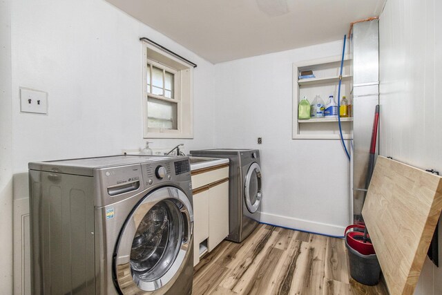 1722 N Benson Rd, Fountain, MI 49410 - laundry area with washing machine and dryer, light wood finished floors, and baseboards