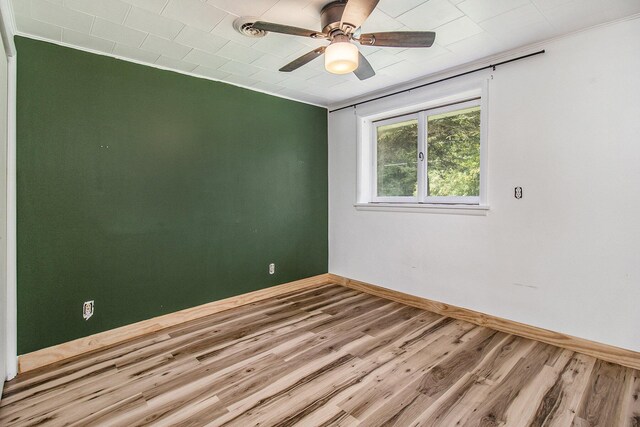 1722 N Benson Rd, Fountain, MI 49410 - spare room featuring baseboards, wood finished floors, and ceiling fan