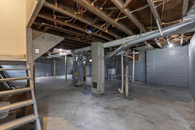 basement with water heater and sink