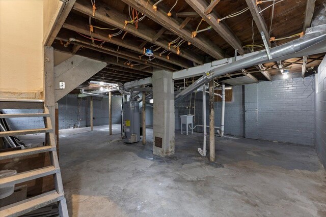 12048 Longview St, Detroit, MI 48213 - unfinished basement featuring gas water heater and a sink