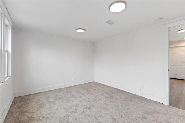 carpeted spare room with plenty of natural light