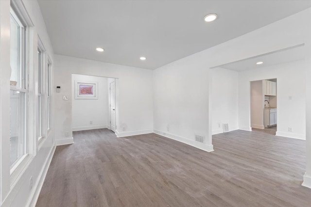 12048 Longview St, Detroit, MI 48213 - spare room with wood finished floors, baseboards, recessed lighting, and plenty of natural light