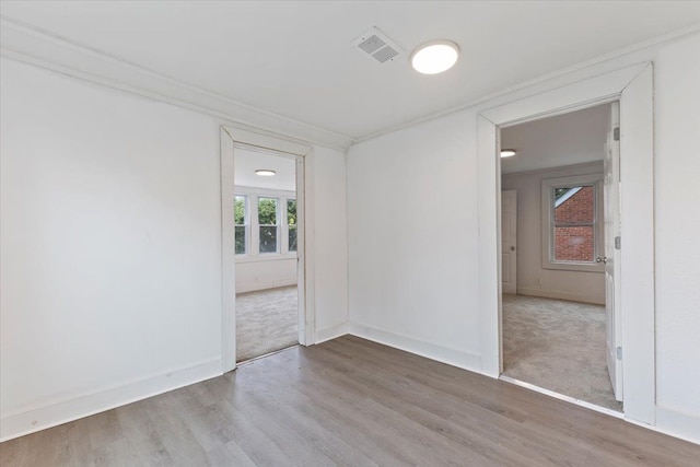 spare room featuring light wood-type flooring