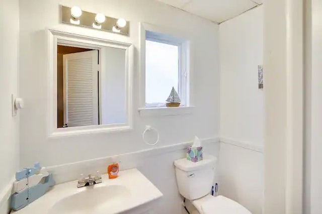 bathroom with toilet and sink