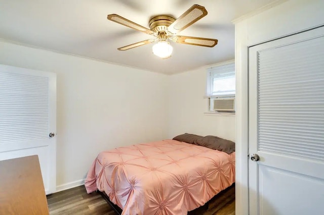 bedroom featuring ceiling fan and dark hardwood / wood-style flooring