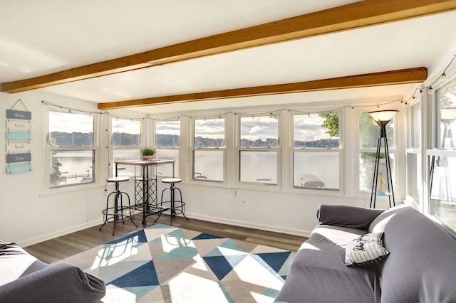 sunroom with beam ceiling