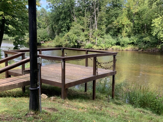 15070 Rapids Dr, Hersey, MI 49639 - dock featuring a water view and a forest view