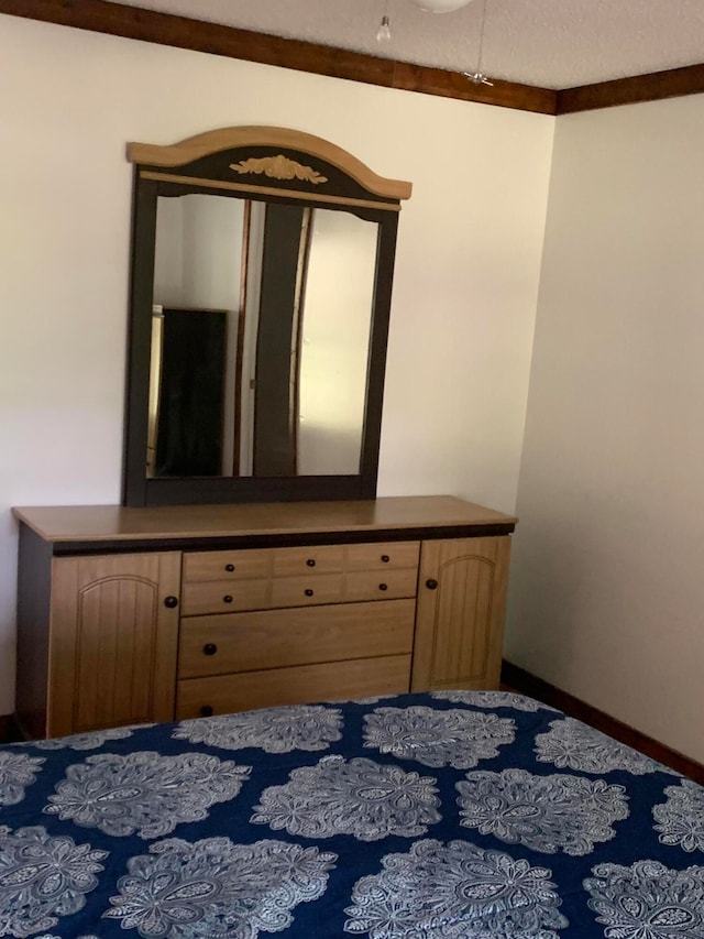 unfurnished bedroom featuring crown molding