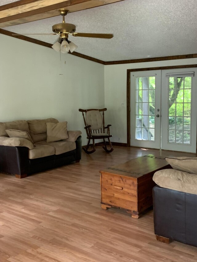 15070 Rapids Dr, Hersey, MI 49639 - living room with light wood-style floors, crown molding, ceiling fan, and french doors