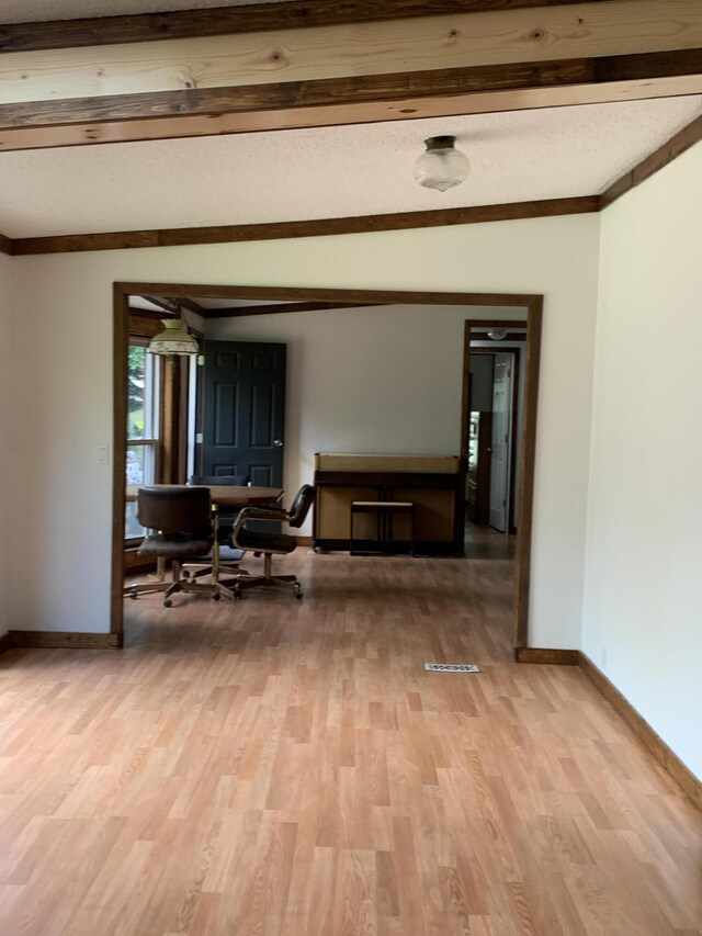 15070 Rapids Dr, Hersey, MI 49639 - hallway with light wood-style flooring, baseboards, and beam ceiling