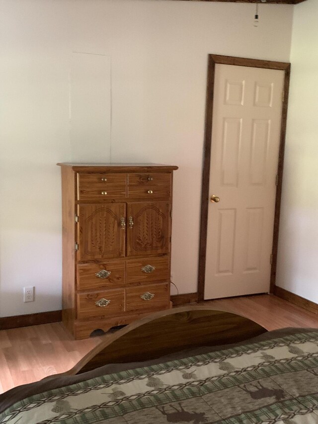 15070 Rapids Dr, Hersey, MI 49639 - bedroom with baseboards and light wood-style flooring
