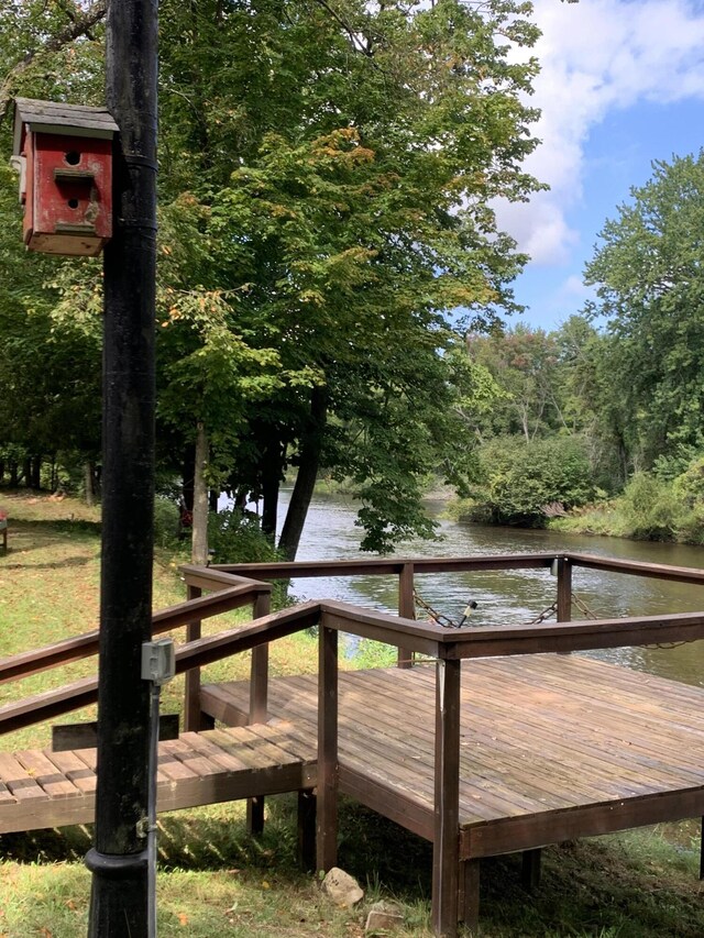 15070 Rapids Dr, Hersey, MI 49639 - wooden terrace with a water view