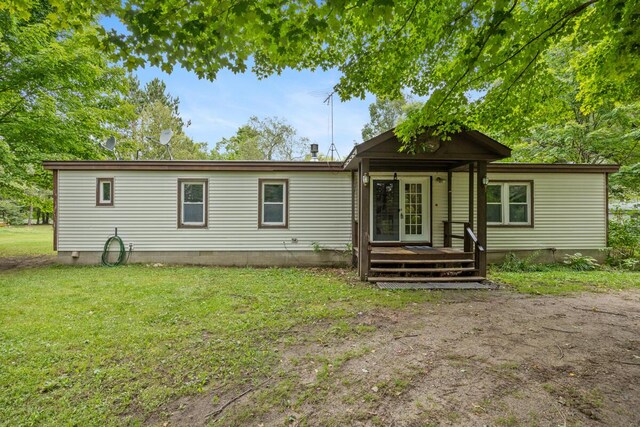 15070 Rapids Dr, Hersey, MI 49639 - rear view of house with a yard