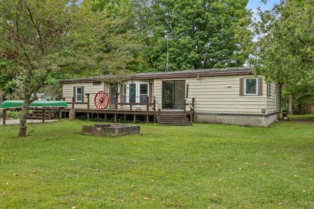 15070 Rapids Dr, Hersey, MI 49639 - rear view of property featuring a deck and a lawn