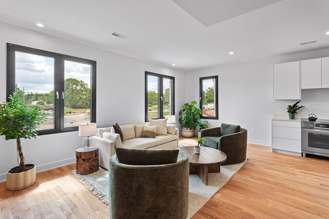 2251 Trillium Ln, Ann Arbor, MI 48104 - living room featuring light wood-style flooring, recessed lighting, and baseboards
