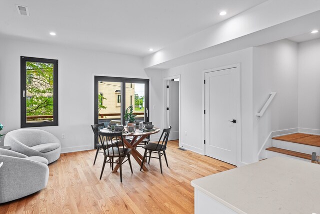 2251 Trillium Ln, Ann Arbor, MI 48104 - dining space with light wood-type flooring, stairway, recessed lighting, and baseboards