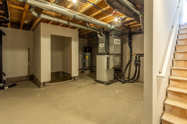 2251 Trillium Ln, Ann Arbor, MI 48104 - unfinished basement featuring stairs, hybrid water heater, and heating unit