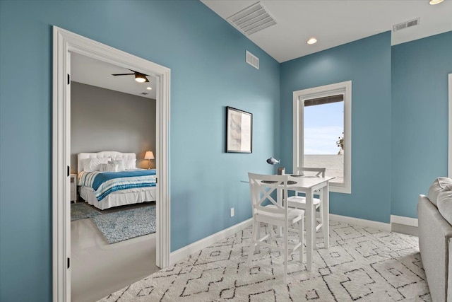 carpeted dining room featuring ceiling fan