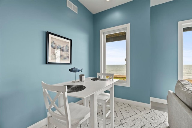 dining space with a water view