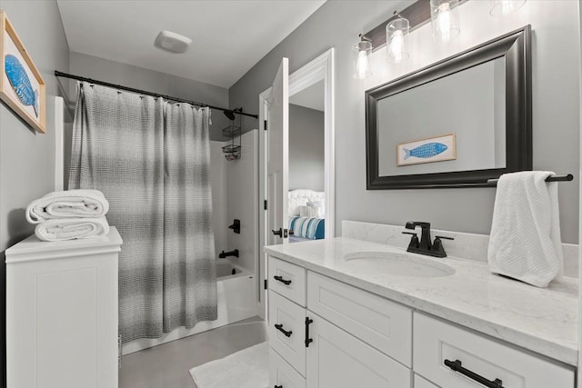 bathroom with vanity, concrete floors, and shower / bath combo