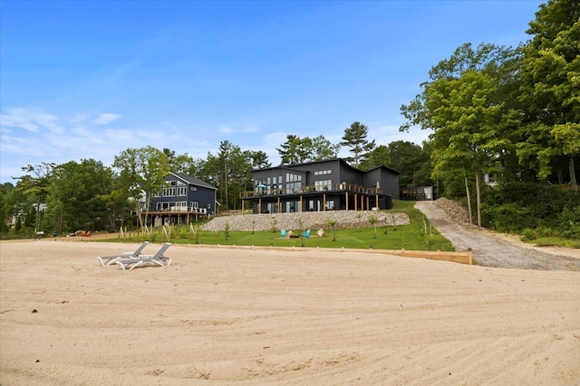 view of front facade with a wooden deck