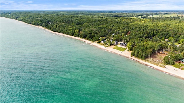 birds eye view of property with a water view and a view of the beach