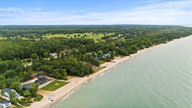 drone / aerial view with a water view and a beach view