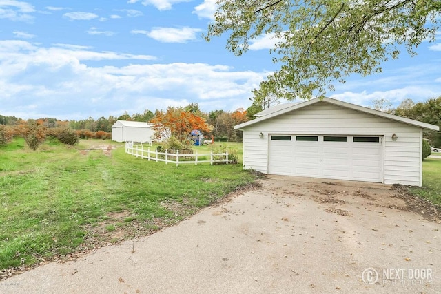 garage featuring a yard