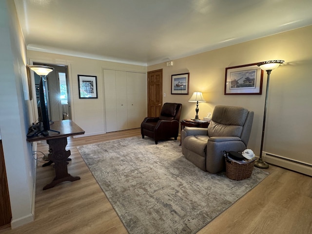 3437 3rd St Unit G, Trenton, MI 48183 - living area featuring wood finished floors and baseboard heating