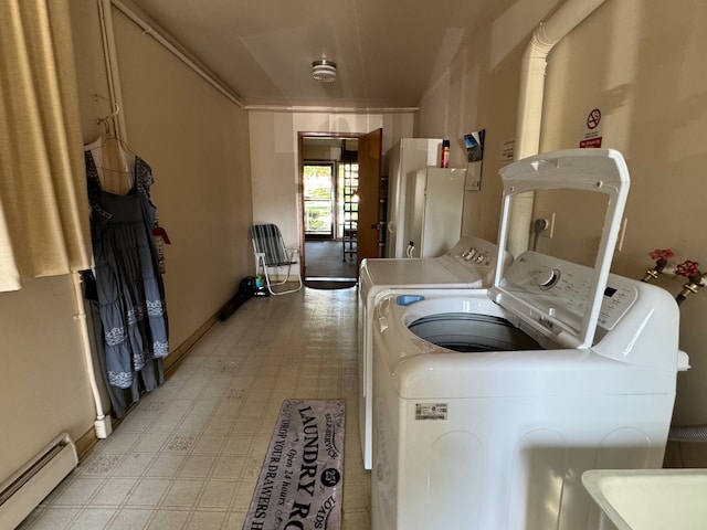3437 3rd St Unit G, Trenton, MI 48183 - laundry area with a baseboard heating unit, washing machine and clothes dryer, and light flooring