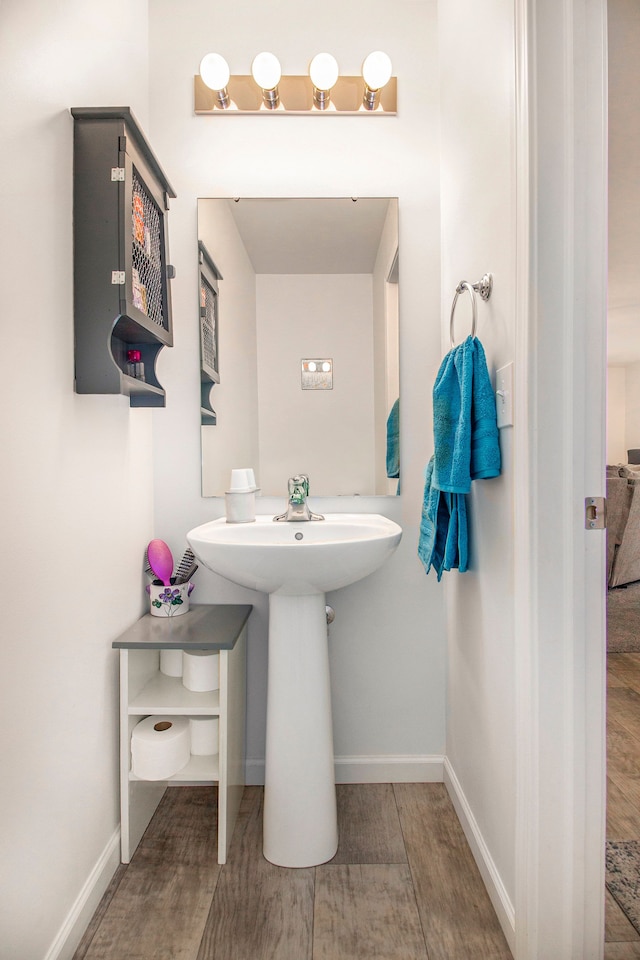 bathroom featuring hardwood / wood-style flooring and sink