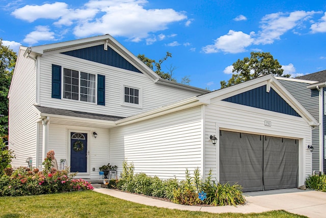 view of front of home featuring a garage and a front yard