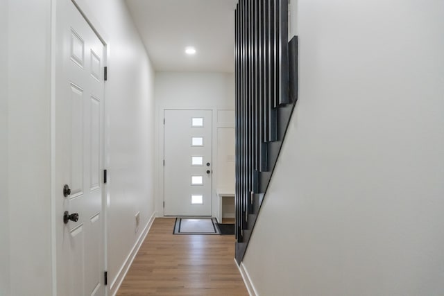 doorway to outside with wood-type flooring