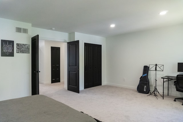 bedroom with light carpet