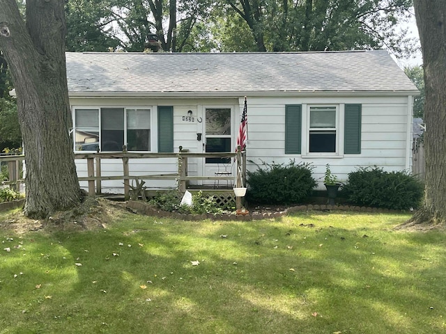 view of front of home with a front lawn