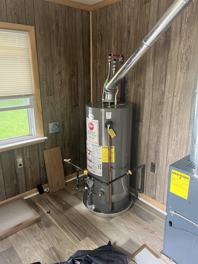 utility room featuring water heater