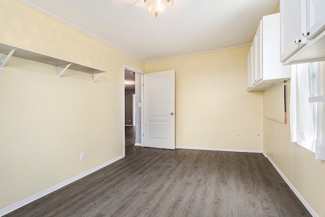 interior space with wood-type flooring and crown molding