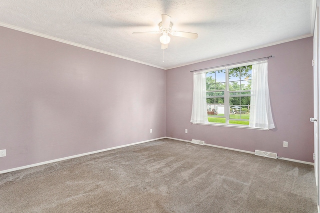 carpeted empty room featuring ceiling fan, crown molding, and a textured ceiling