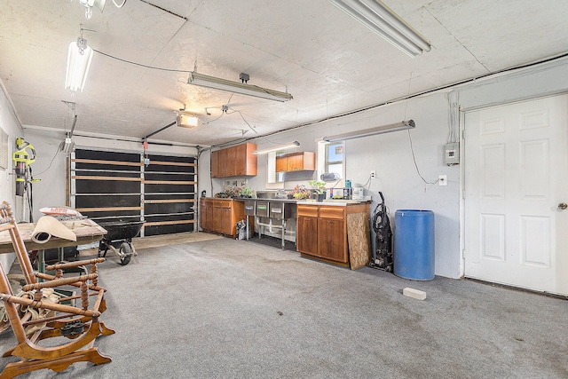 garage featuring a workshop area and a garage door opener