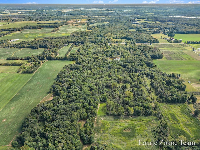 birds eye view of property with a rural view