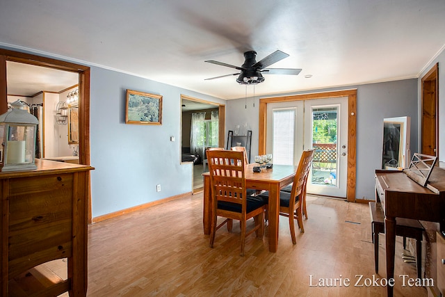 dining space with french doors, light hardwood / wood-style floors, ceiling fan, and crown molding